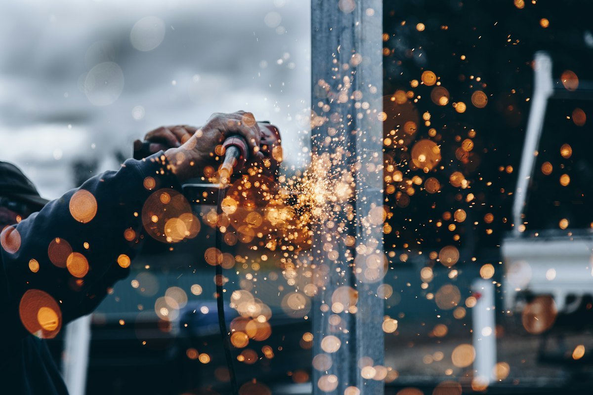 Welding sparks in the fabrication bay